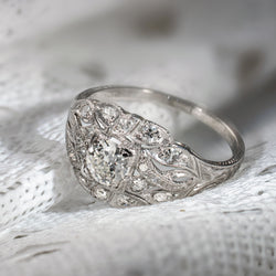 Antique platinum diamond ring with Old European Cut center diamond and openwork setting
