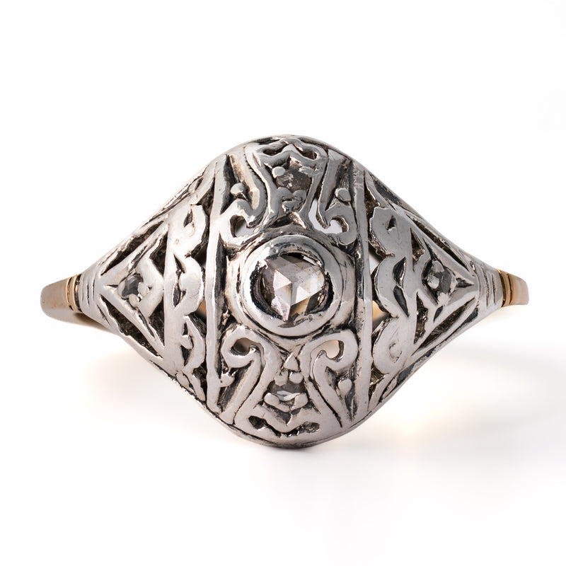 Overhead direct view of Edwardian openwork lace ring showing center antique rose-cut diamond and silver patina
