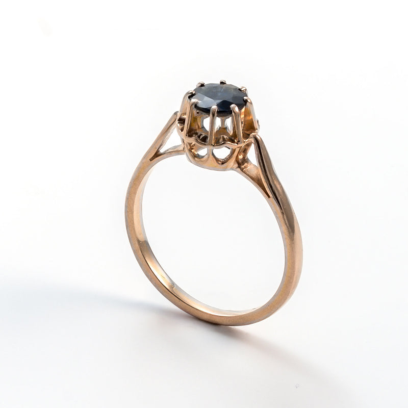 Left-angled upright view of an 18k yellow gold antique ring, highlighting the "Beauty of Character" in the setting.
