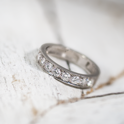 Platinum band featuring eleven bright natural diamonds with elegant low-profile design