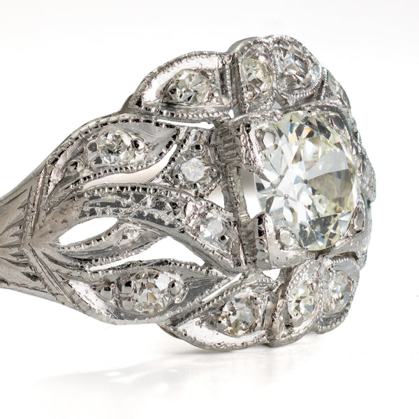 Rear view of a circa 1918 to 1925 platinum and old european cut diamond ring showing engraved shoulders and openwork construction