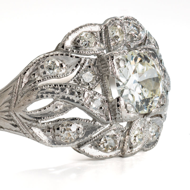 Rear view of a circa 1918 to 1925 platinum and old european cut diamond ring showing engraved shoulders and openwork construction