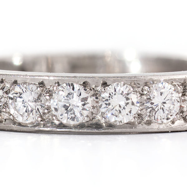 Macro detail showing clean near-colorless diamonds in a handcrafted platinum setting