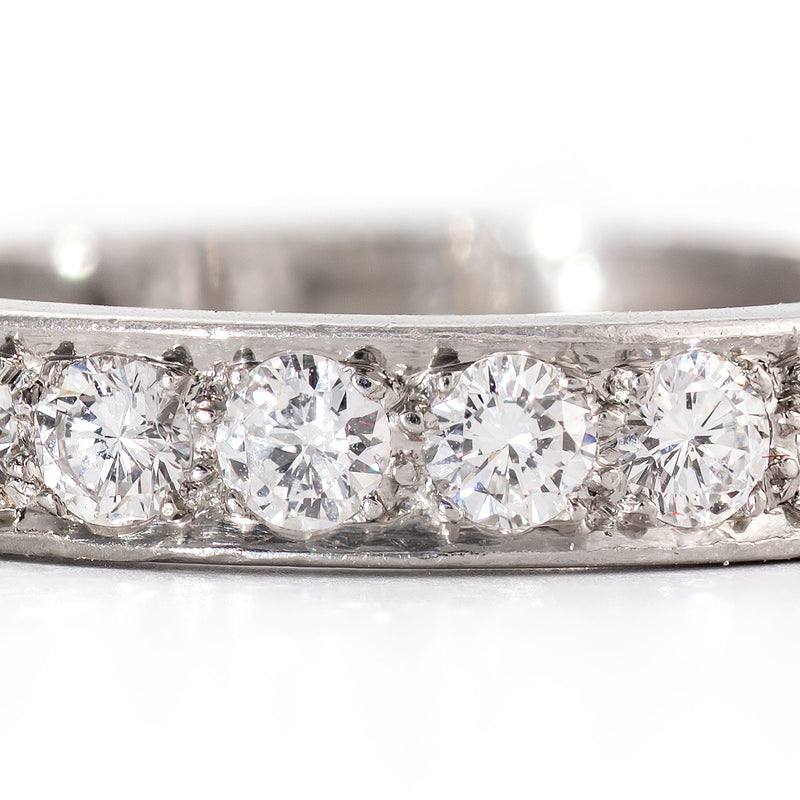 Macro detail showing clean near-colorless diamonds in a handcrafted platinum setting