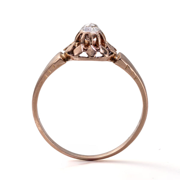 Upright profile emphasizing the height, buttercup gallery, and closed-back construction of this antique French diamond ring