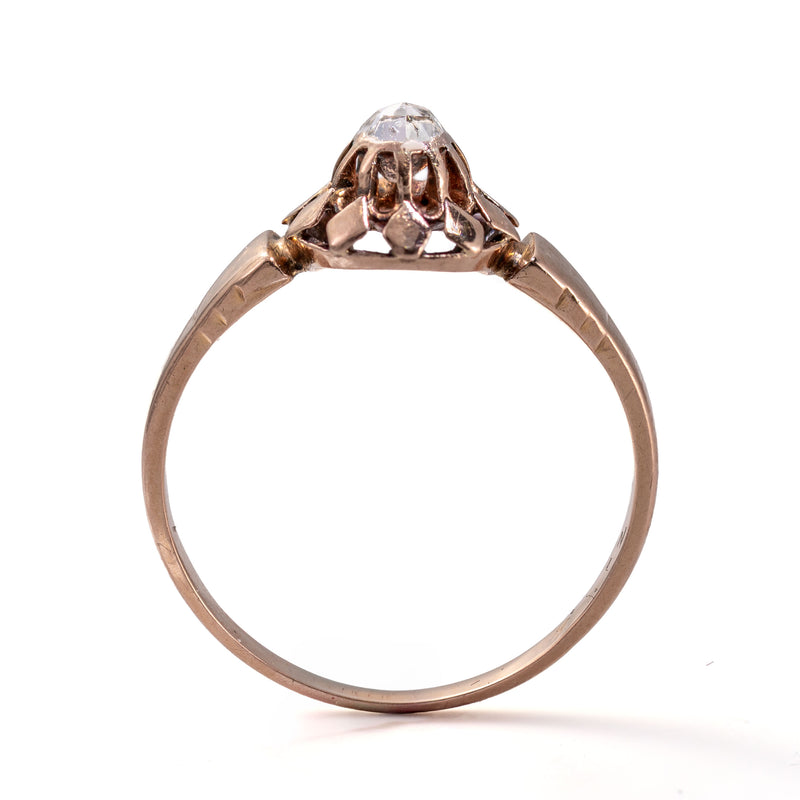 Upright profile emphasizing the height, buttercup gallery, and closed-back construction of this antique French diamond ring