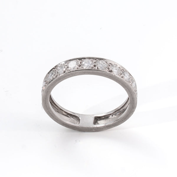 Overhead image of a minimalist platinum ring with continuous brilliant-cut diamonds