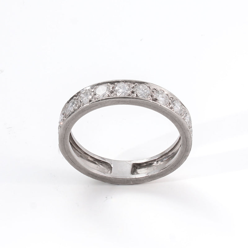 Overhead image of a minimalist platinum ring with continuous brilliant-cut diamonds