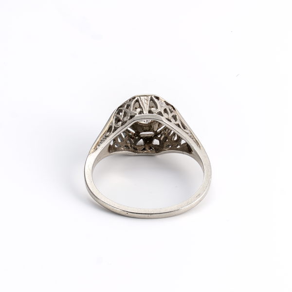 White Gold ring with intricate design on a white background