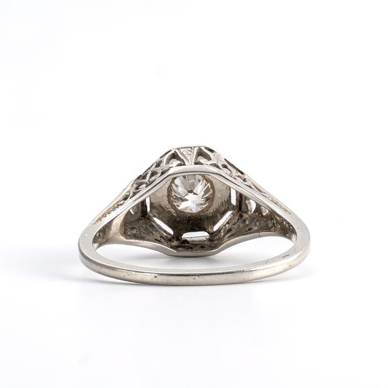 Silver ring with a diamond on a white background