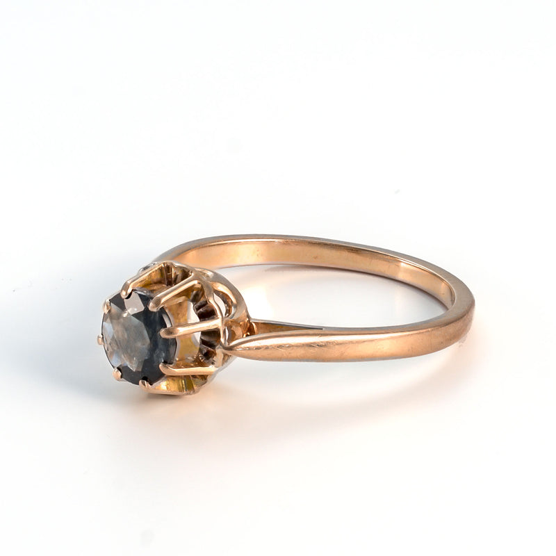 View of the interior ring band and the open under-gallery allowing light through the natural sapphire.