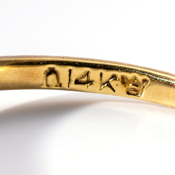 Hallmarks an Omega symbolstamped 14k and a crown