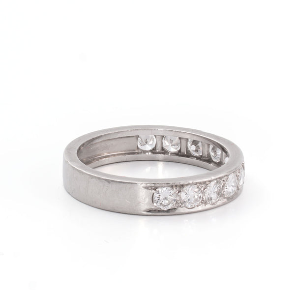 Side perspective emphasizing the sculptural profile and clean modern lines of the ring