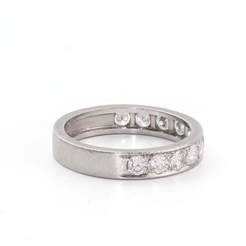 Side perspective emphasizing the sculptural profile and clean modern lines of the ring