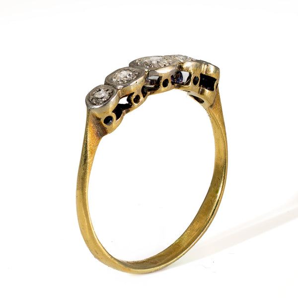 Perspective view showing the low-profile curved height and scalloped pierced undergallery of the platinum diamond setting.
