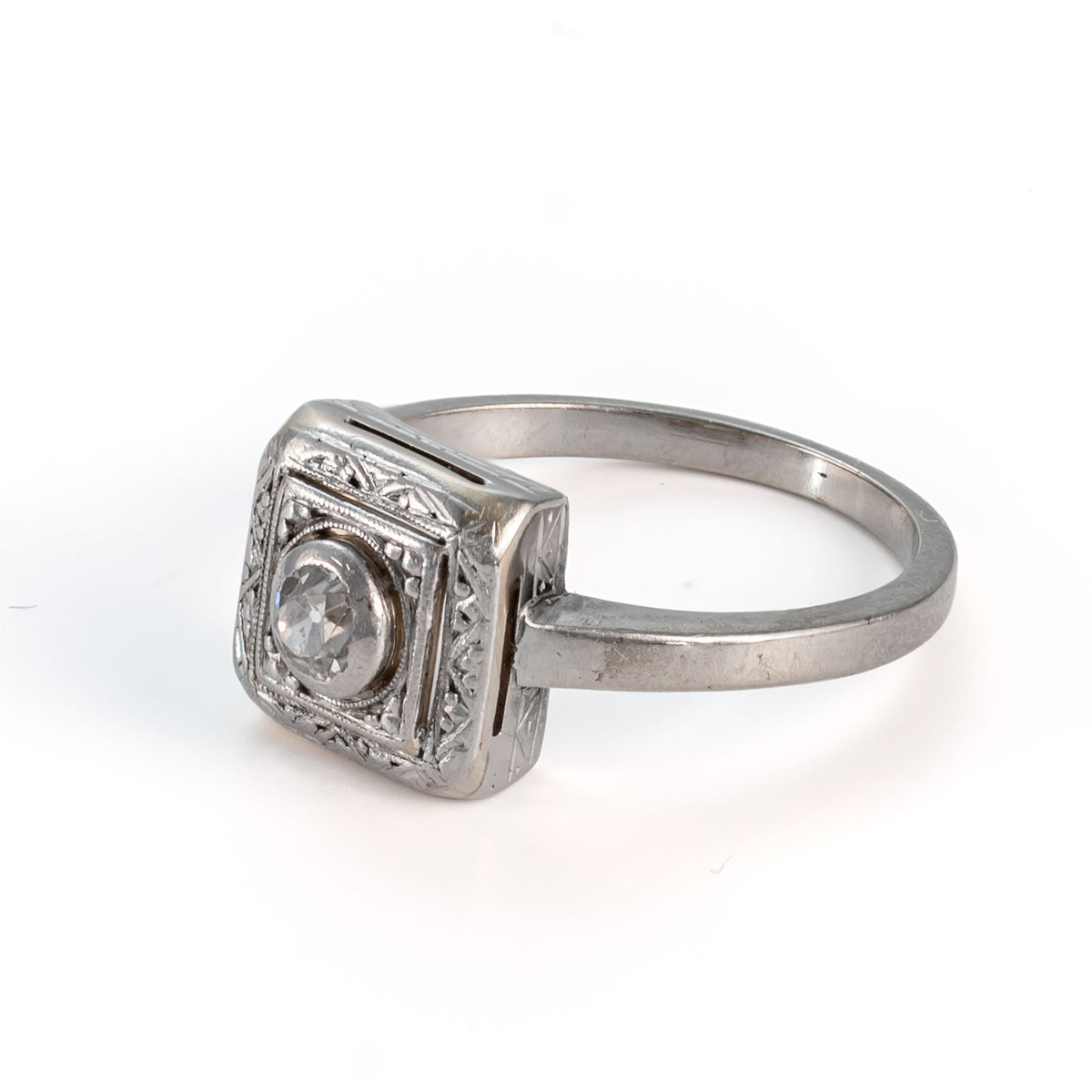 Left side profile of a circa late 30's Art Deco shield form Old European cut diamond ring