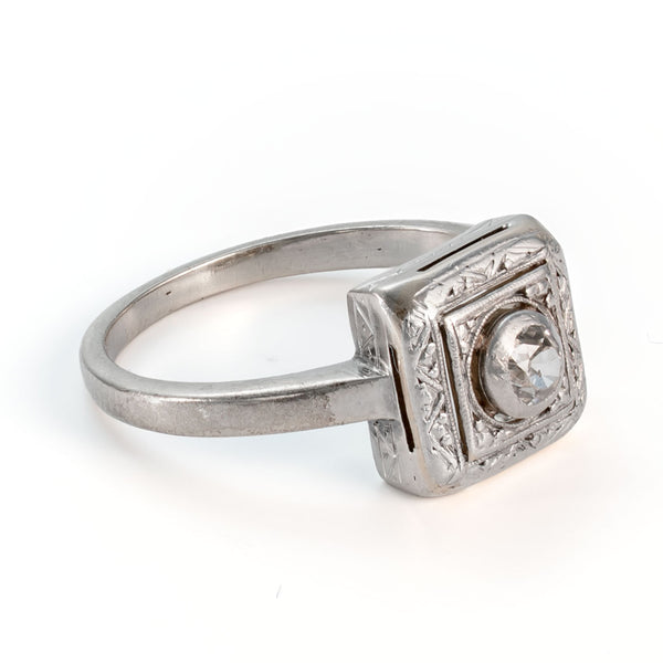 Side profile of a circa 1935 shield form diamond ring showing engraved mounting