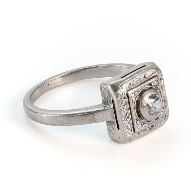 Side profile of a circa 1935 shield form diamond ring showing engraved mounting