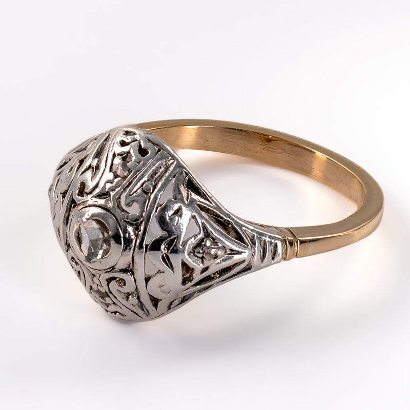 Angled macro view of antique Three-quarter side angle of Edwardian diamond ring highlighting arched dome profile and original fluted shoulders