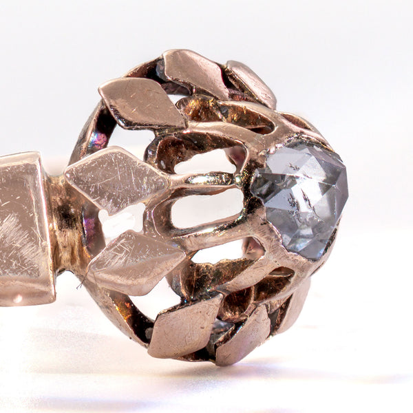 Close-up side detail of the antique rose cut diamond and early Victorian buttercup mounting