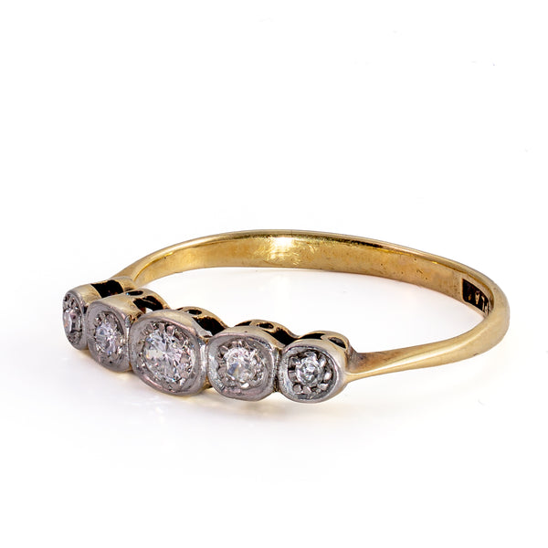 Side-profile view of antique Edwardian 5-stone diamond ring showing low-profile carved platinum settings and yellow gold band.