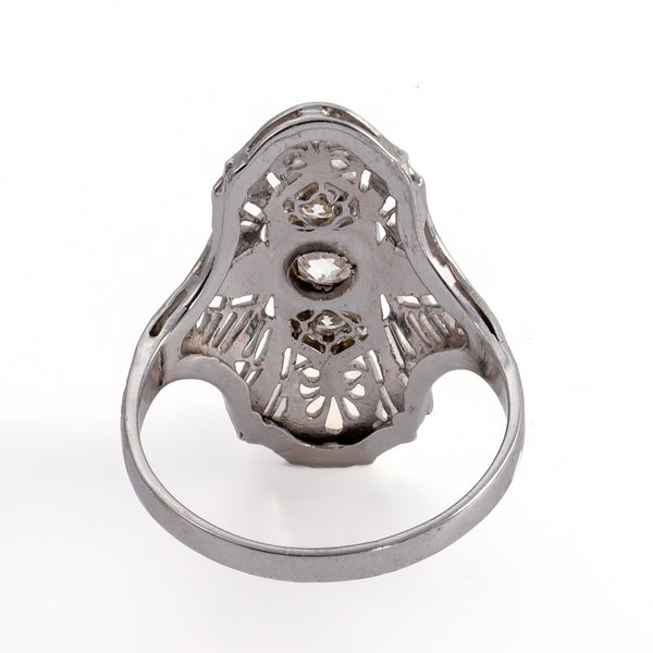 Reverse underside view showing openwork metal structure and diamond light ports.