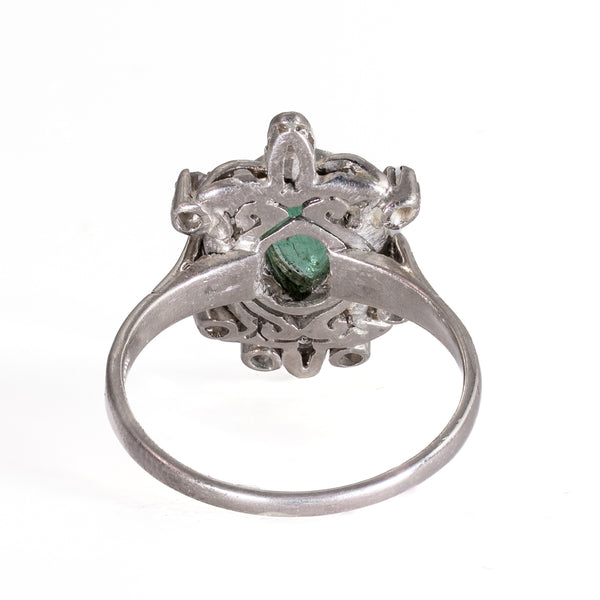 Underside view showing the pierced gallery and open-back emerald setting of vintage 1940s palladium ring
