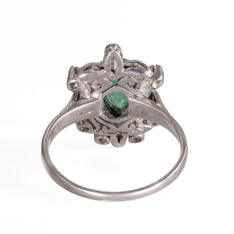 Underside view showing the pierced gallery and open-back emerald setting of vintage 1940s palladium ring