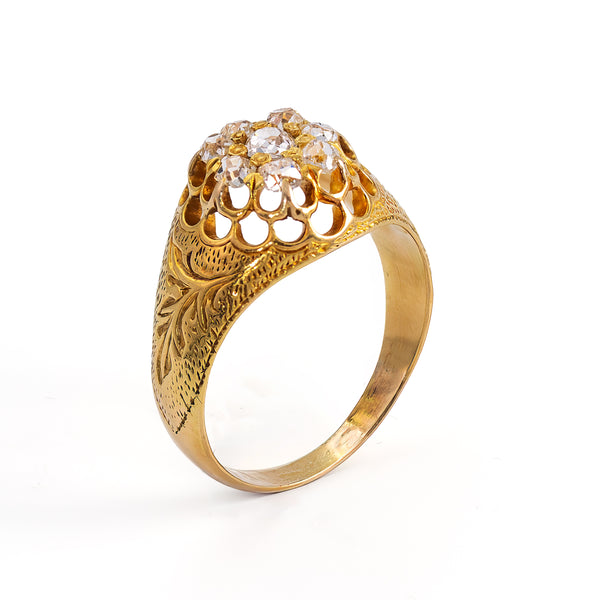 upright side view showing the engraving and pierced gallery of a late Victorian era diamond ring