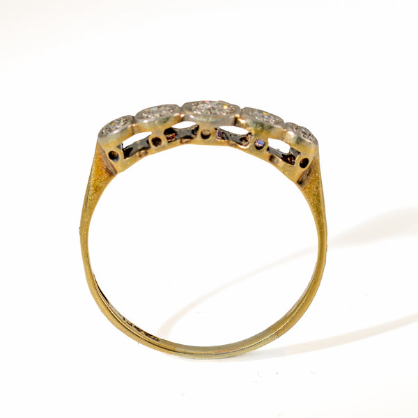 Upright view of Edwardian 5-stone diamond ring displaying the open arc undergallery and flat bottom 18ct gold shank.