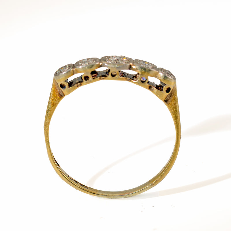 Upright view of Edwardian 5-stone diamond ring displaying the open arc undergallery and flat bottom 18ct gold shank.