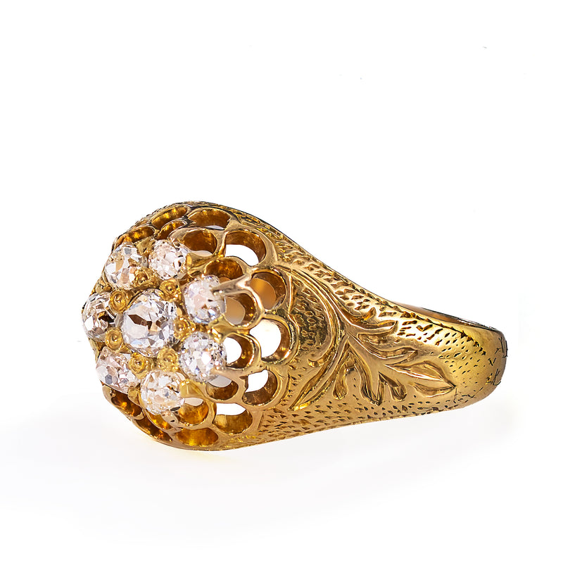 Additional perspective of an authentic late 19th Century diamond cluster ring featuring eight natural Old Mine Cut diamonds and finely preserved hand craftsmanship.