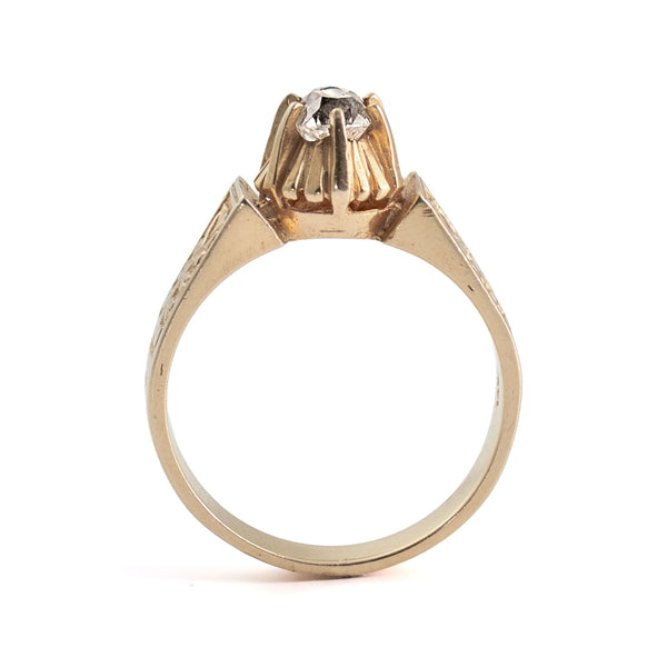 Gold ring with a diamond on a white background
