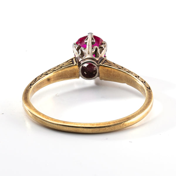 Antique ruby ring showing engraved gold shank and period craftsmanship