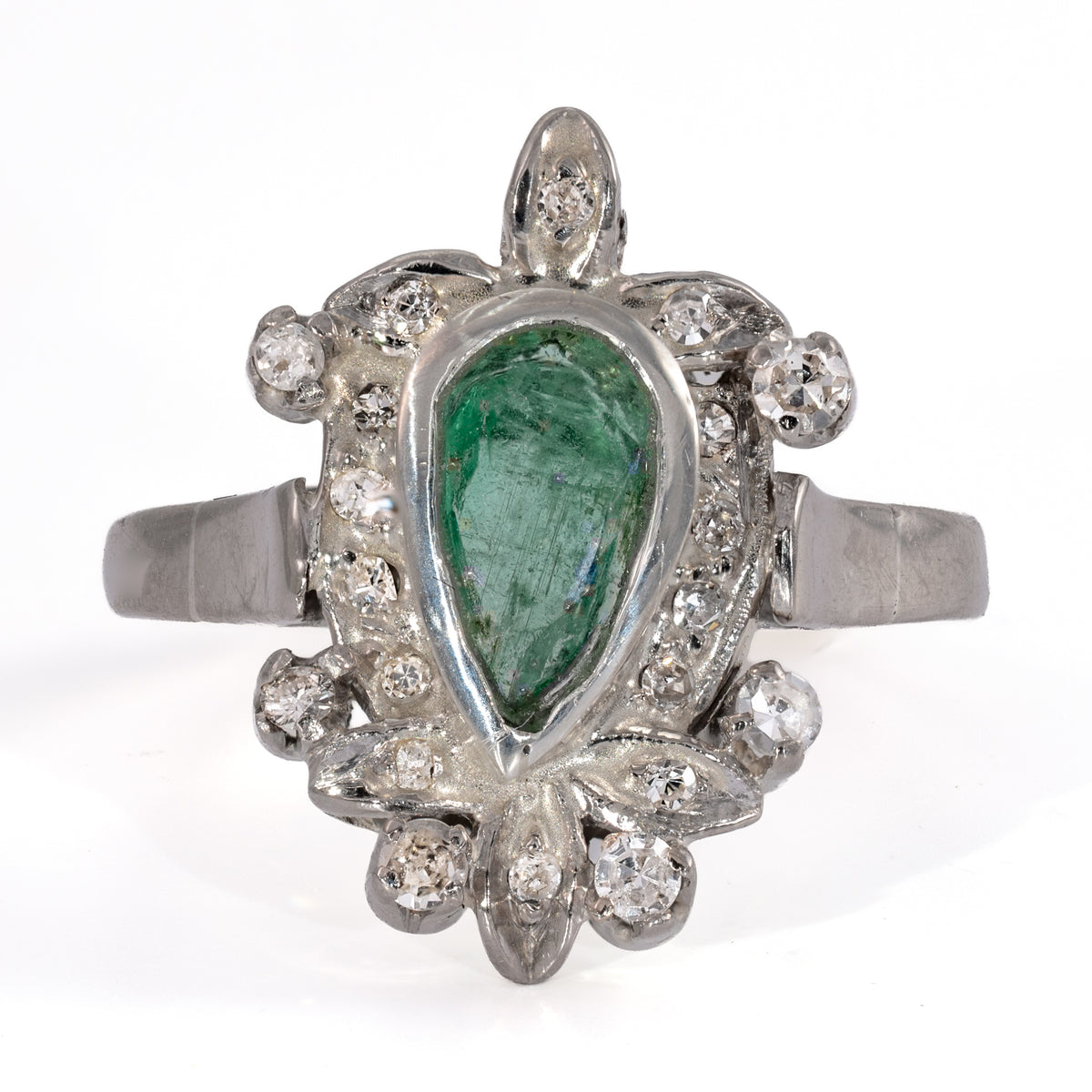 Video of a vintage palladium and emerald cocktail ring with a pear shaped emerald and 20 acccent diamonds