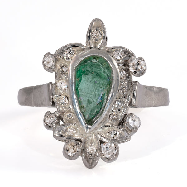 Video of a vintage palladium and emerald cocktail ring with a pear shaped emerald and 20 acccent diamonds