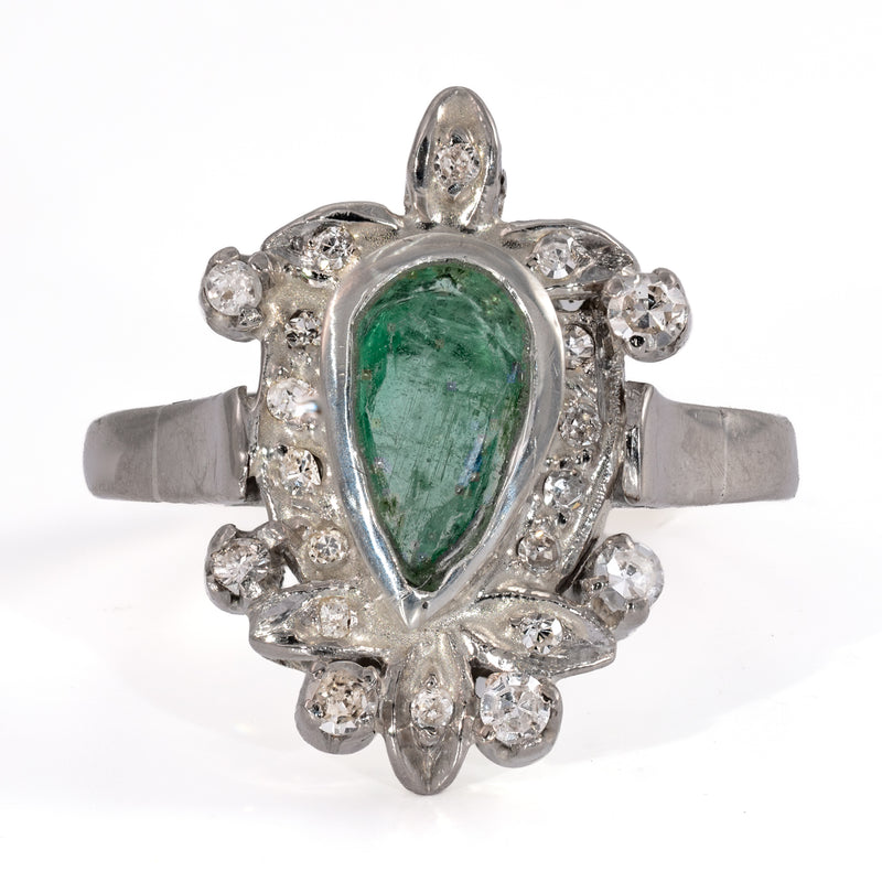 Video of a vintage palladium and emerald cocktail ring with a pear shaped emerald and 20 acccent diamonds