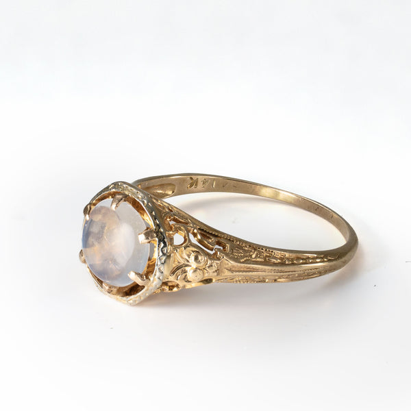 Side detail of the solid 14K gold setting supporting a natural moonstone cabochon