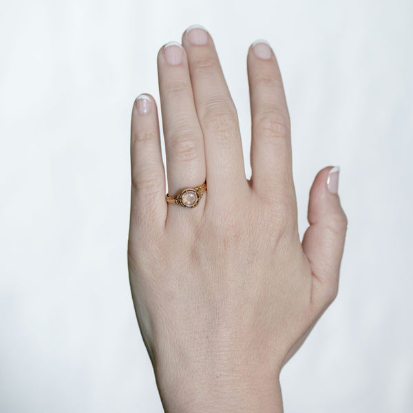 Natural moonstone cabochon ring shown on hand for scale and everyday wear