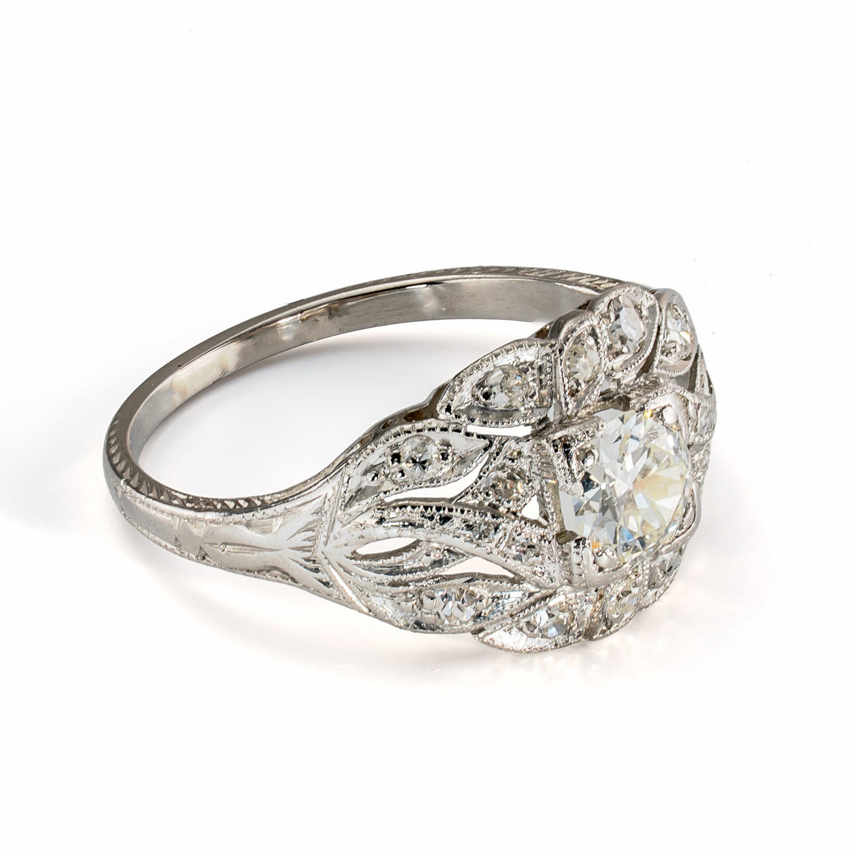 Side profile of vintage platinum diamond ring showing pierced gallery and raised diamond setting