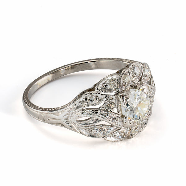 Side profile of vintage platinum diamond ring showing pierced gallery and raised diamond setting