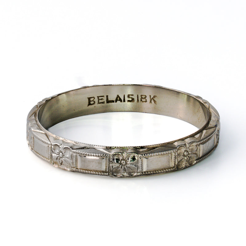 Antique Belais 18K white gold floral band size 8.5 showing interior hallmark and 3.6mm wide exterior pattern.