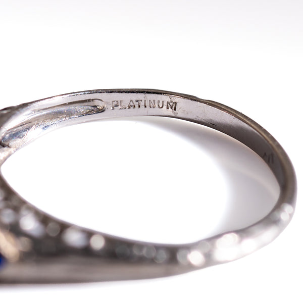 Close-up detail of the inner shank on a late Art Deco diamond ring, clearly showing the antique "PLATINUM" hallmark and period construction.