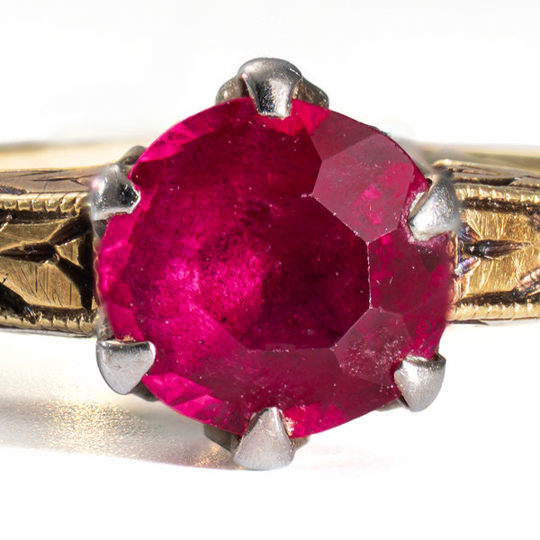 close up of a natural ruby in an antique gold ring