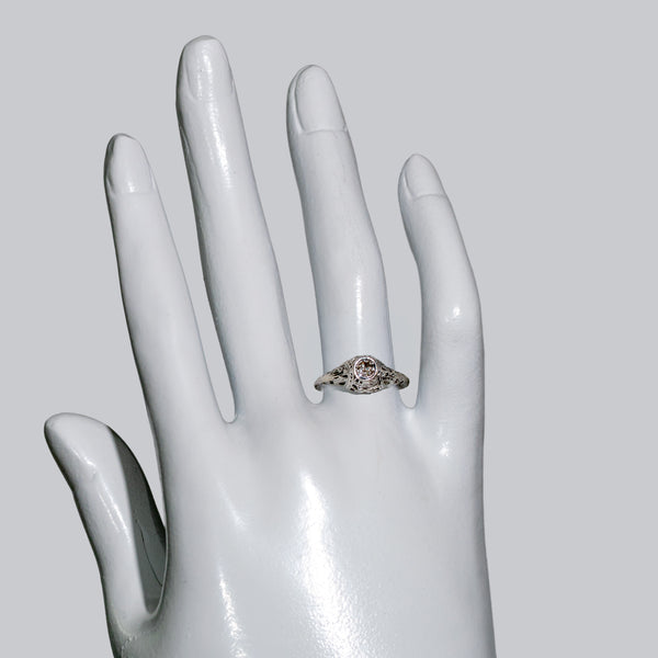 Antique ring faceing up on a hand