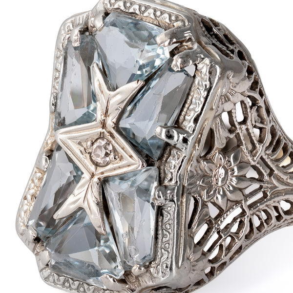 Extreme close-up macro view showing precision faceting on custom-cut aquamarines and hand-finished white gold settings.