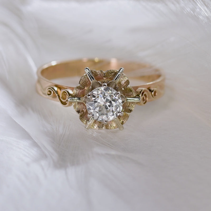 video showing off an art deco 14k gold and an oec diamond in a buttercup setting

