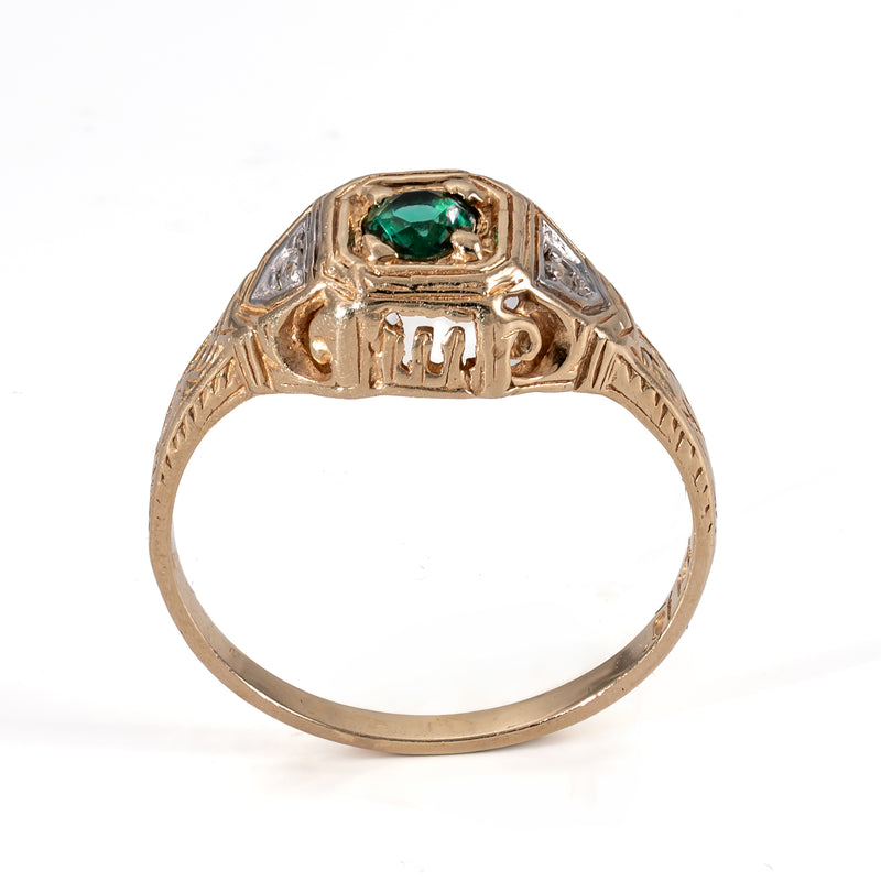 Direct side profile view of the Late Art Deco ring displaying the open pierced gallery beneath the center head.