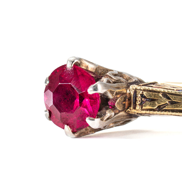 side view closee up of ruby and head in a vintage ring