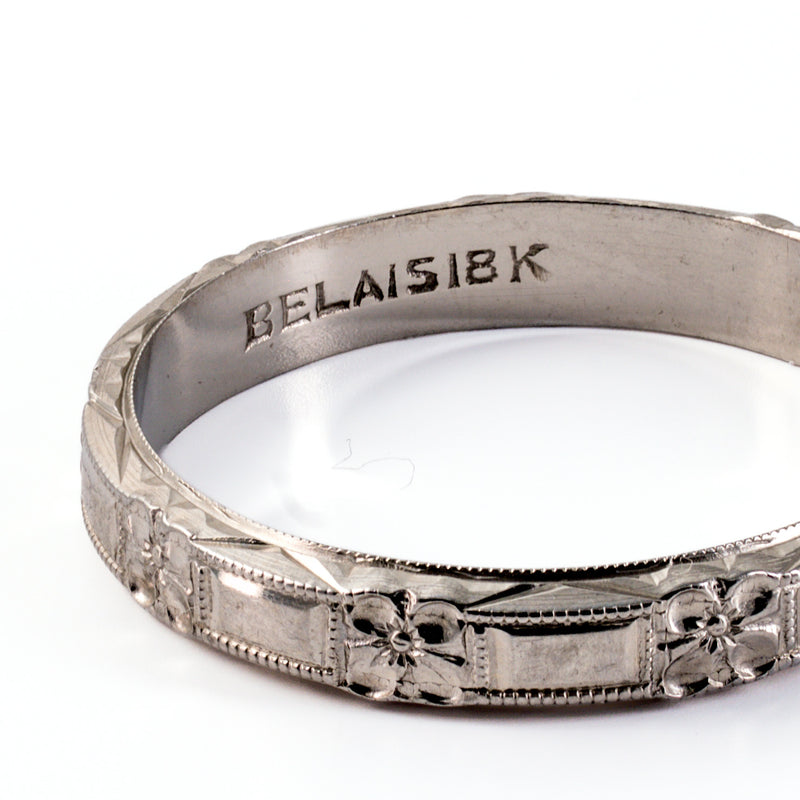 Close-up of authentic stamped BELAIS 18K hallmark on inner shank of antique white gold ring.